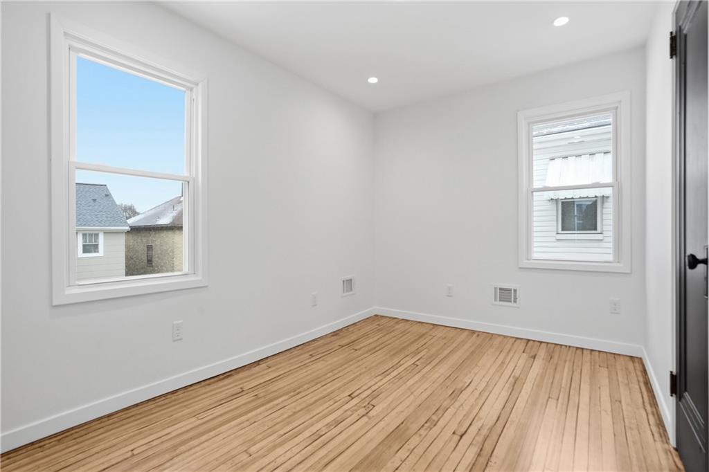 1402 Dickson Street Pittsburgh, PA 15212 - Photo 17 of 25 a view of a room with wooden floor and a window