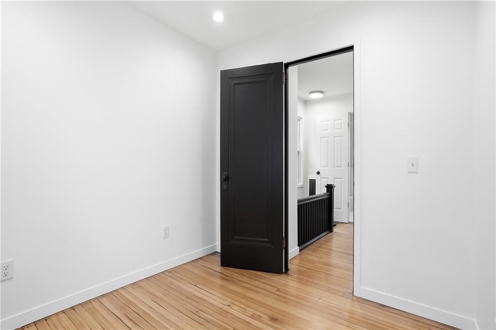 1402 Dickson Street Pittsburgh, PA 15212 - Photo 22 of 25 a view of a hallway with wooden floor