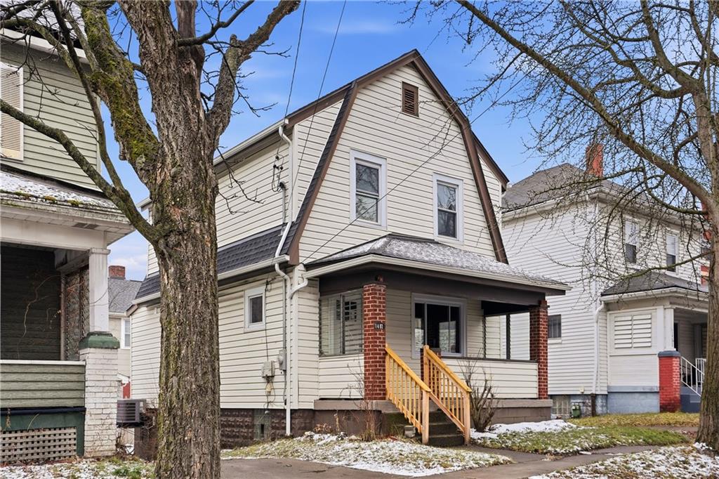 1402 Dickson Street Pittsburgh, PA 15212 - Photo 25 of 25 a front view of a house with a tree