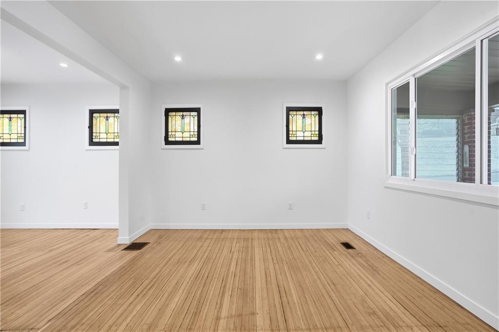 1402 Dickson Street Pittsburgh, PA 15212 - Photo 4 of 25 a view of a room with wooden floor and window