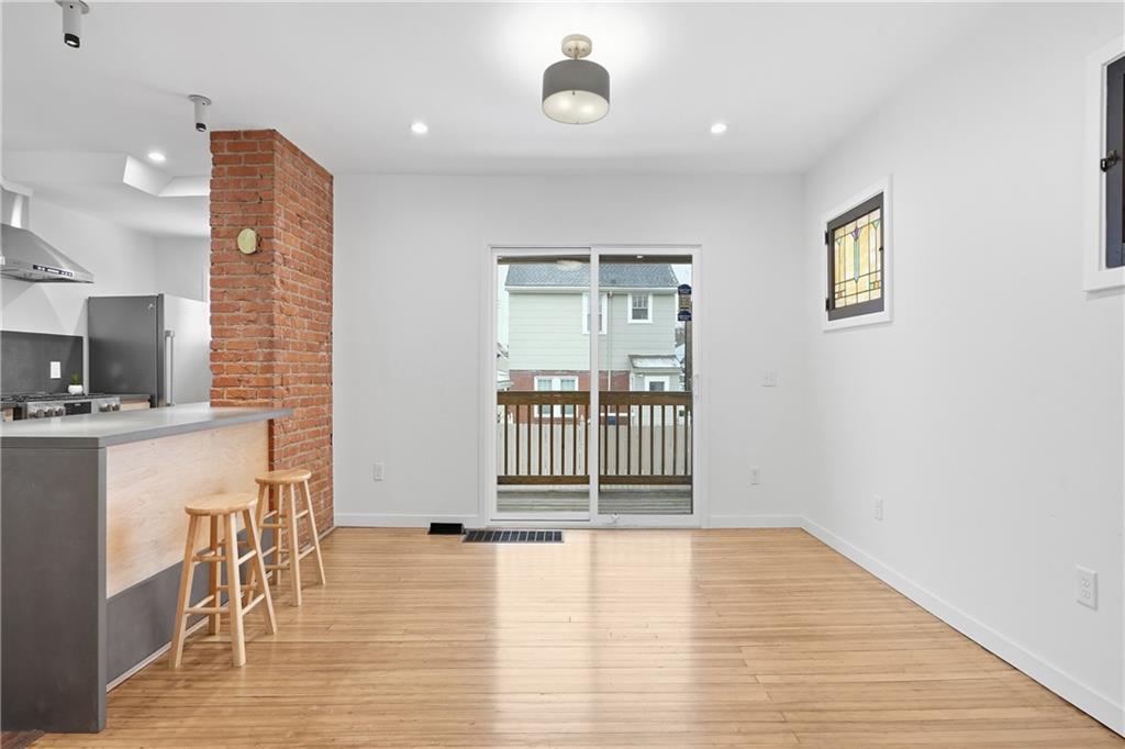 1402 Dickson Street Pittsburgh, PA 15212 - Photo 6 of 25 a view of livingroom with furniture and wooden floor