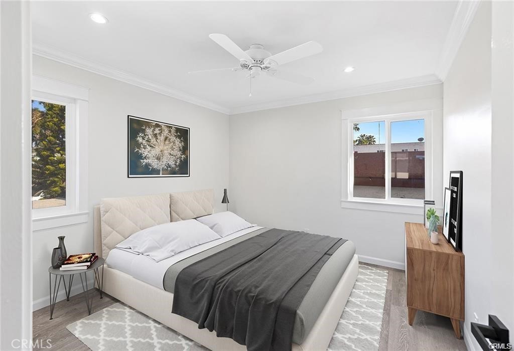 817 Calle Puente, Unit A San Clemente, CA 92672 - Photo 5 of 8 a bedroom with a large bed and a window