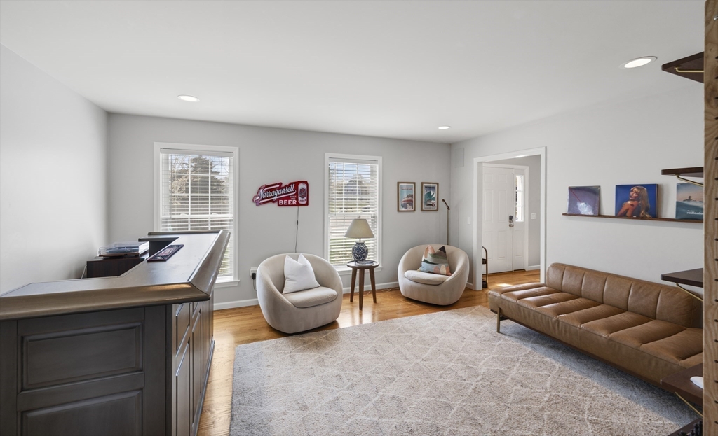 106 Colonial Road Marshfield, MA 02050 - Photo 6 of 16 a living room with furniture and a wooden floor