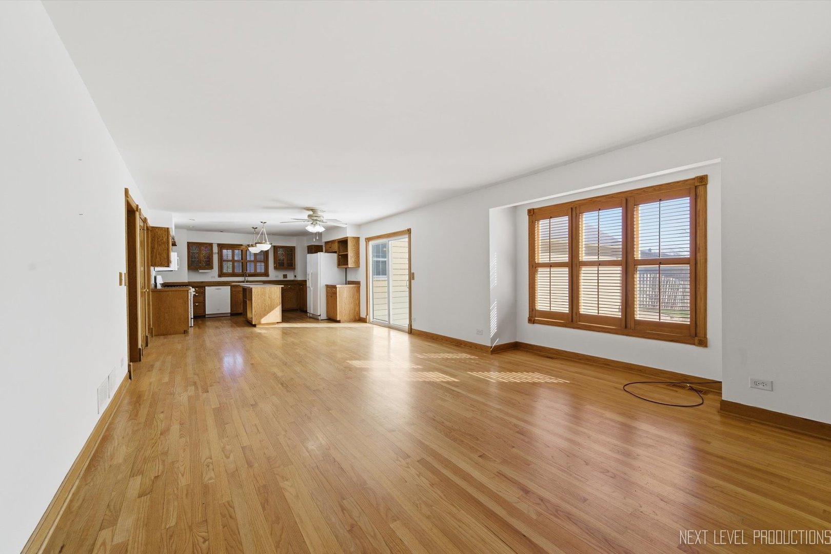 2N879 Howard Road Maple Park, IL 60151 - Photo 15 of 54 a view of empty room with wooden floor and fan