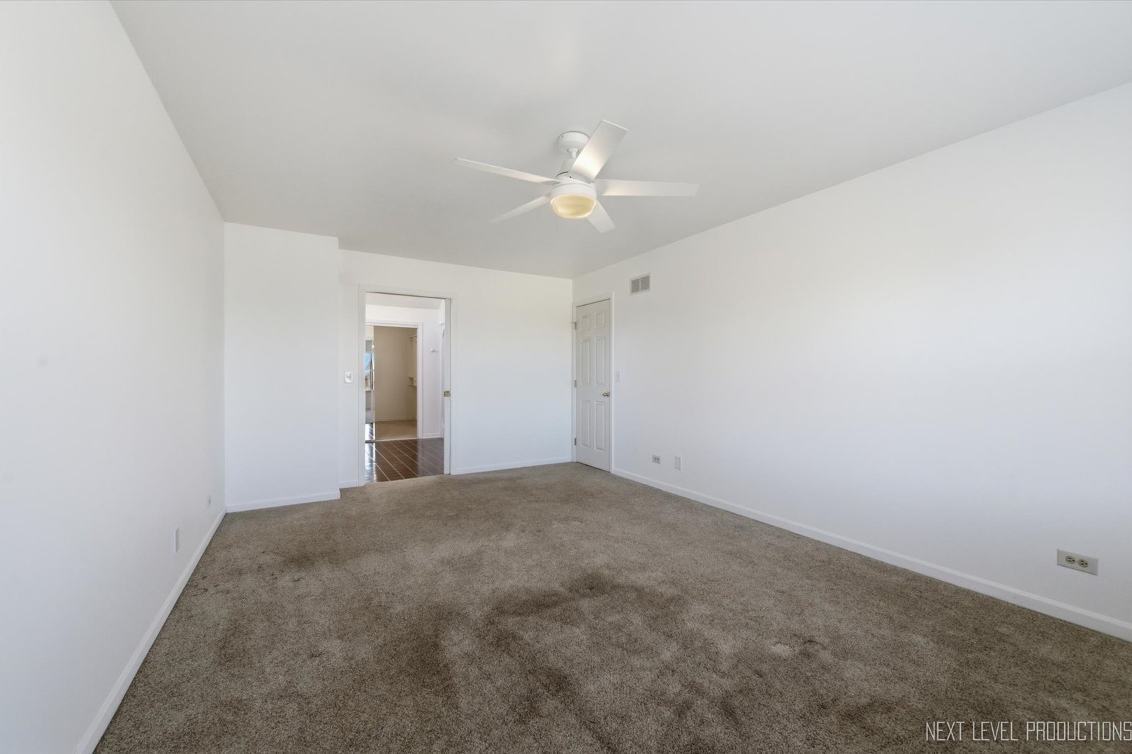 2N879 Howard Road Maple Park, IL 60151 - Photo 20 of 54 a view of a big room with carpet