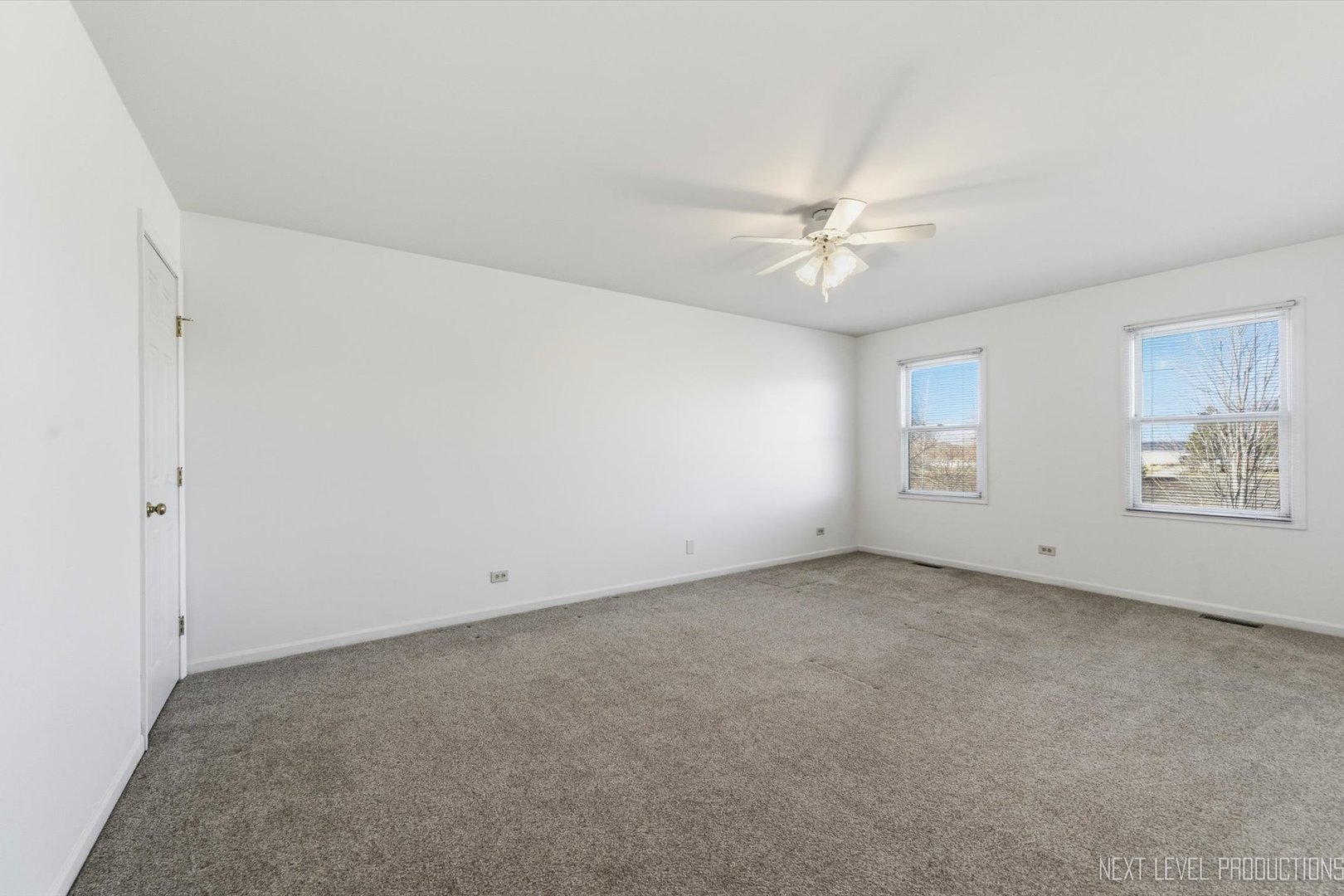 2N879 Howard Road Maple Park, IL 60151 - Photo 24 of 54 an empty room with a window and a ceiling fan