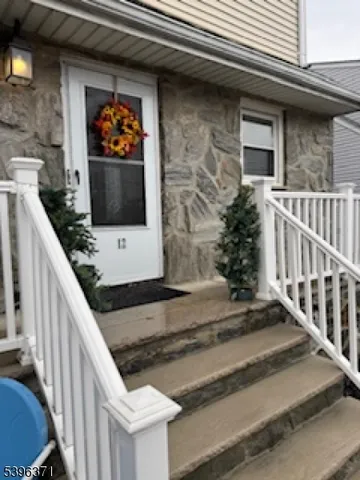 a view of a balcony with furniture