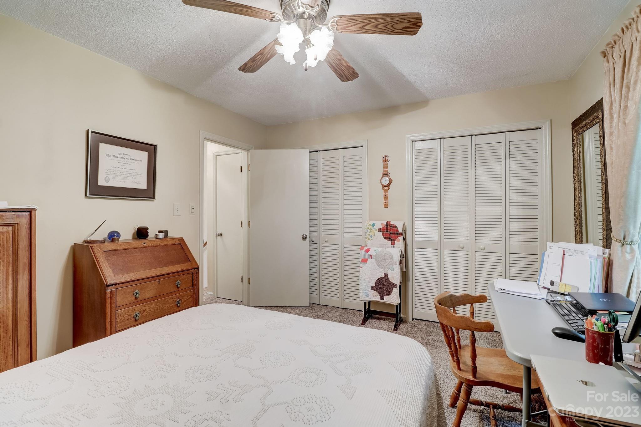 4 Bramblewood Road, Unit 8 Arden, NC 28704 - Photo 17 of 25 a bedroom with a bed and furniture