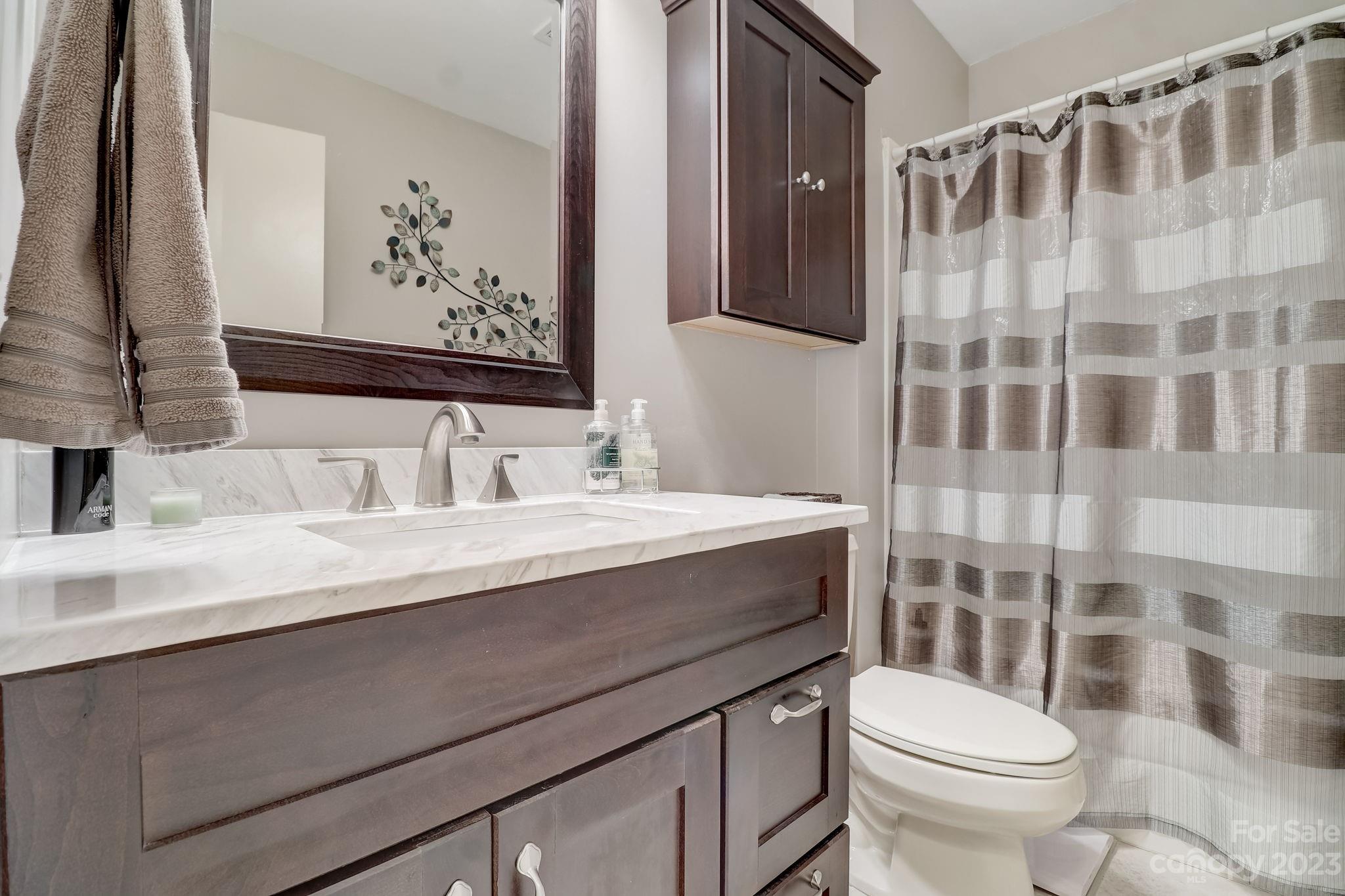4 Bramblewood Road, Unit 8 Arden, NC 28704 - Photo 19 of 25 a bathroom with a sink toilet and shower