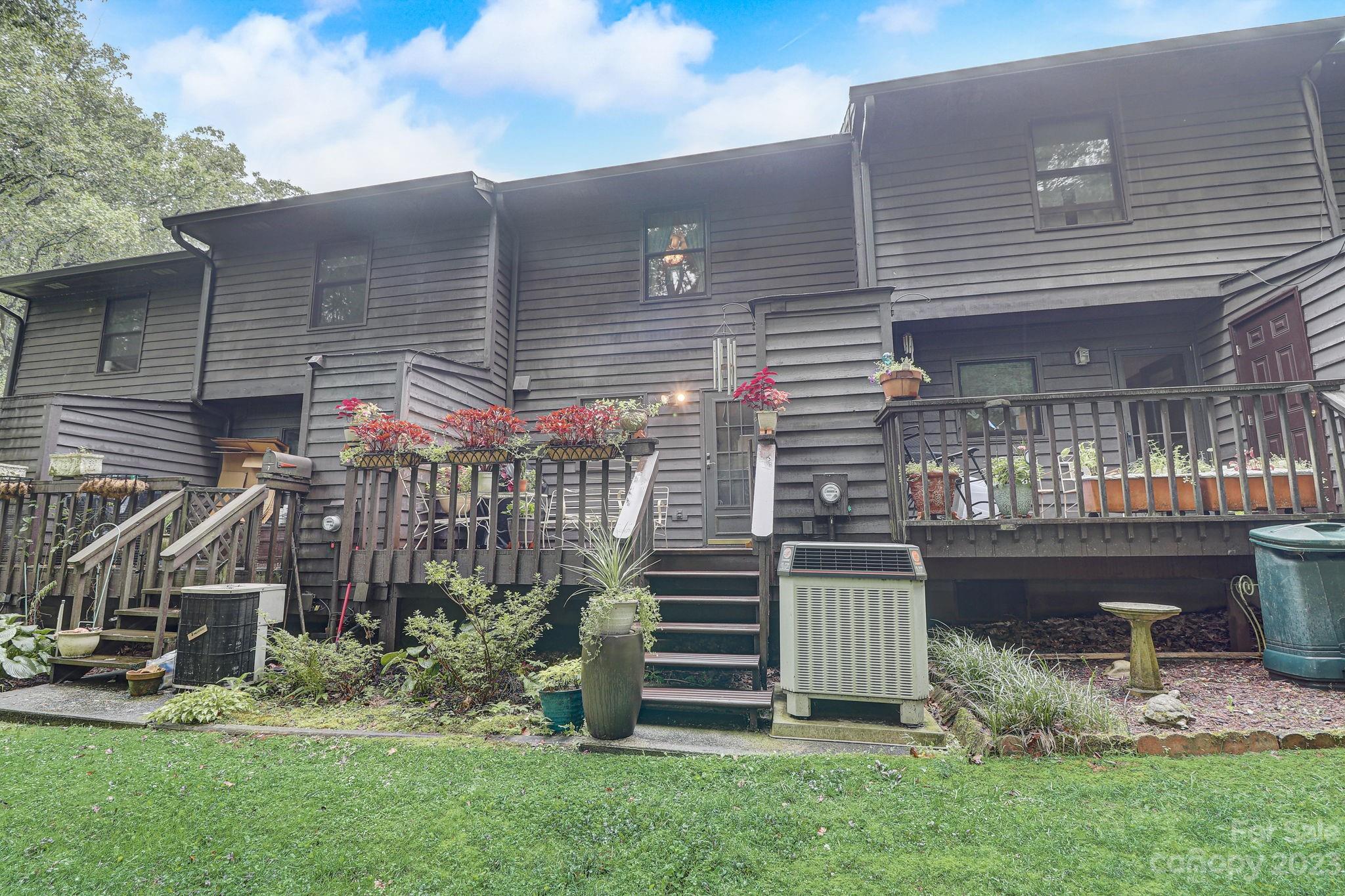 4 Bramblewood Road, Unit 8 Arden, NC 28704 - Photo 24 of 25 a view of a house with a yard and plants
