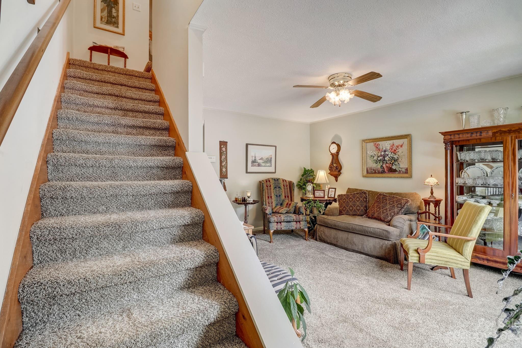 4 Bramblewood Road, Unit 8 Arden, NC 28704 - Photo 3 of 25 a living room with furniture and a stair