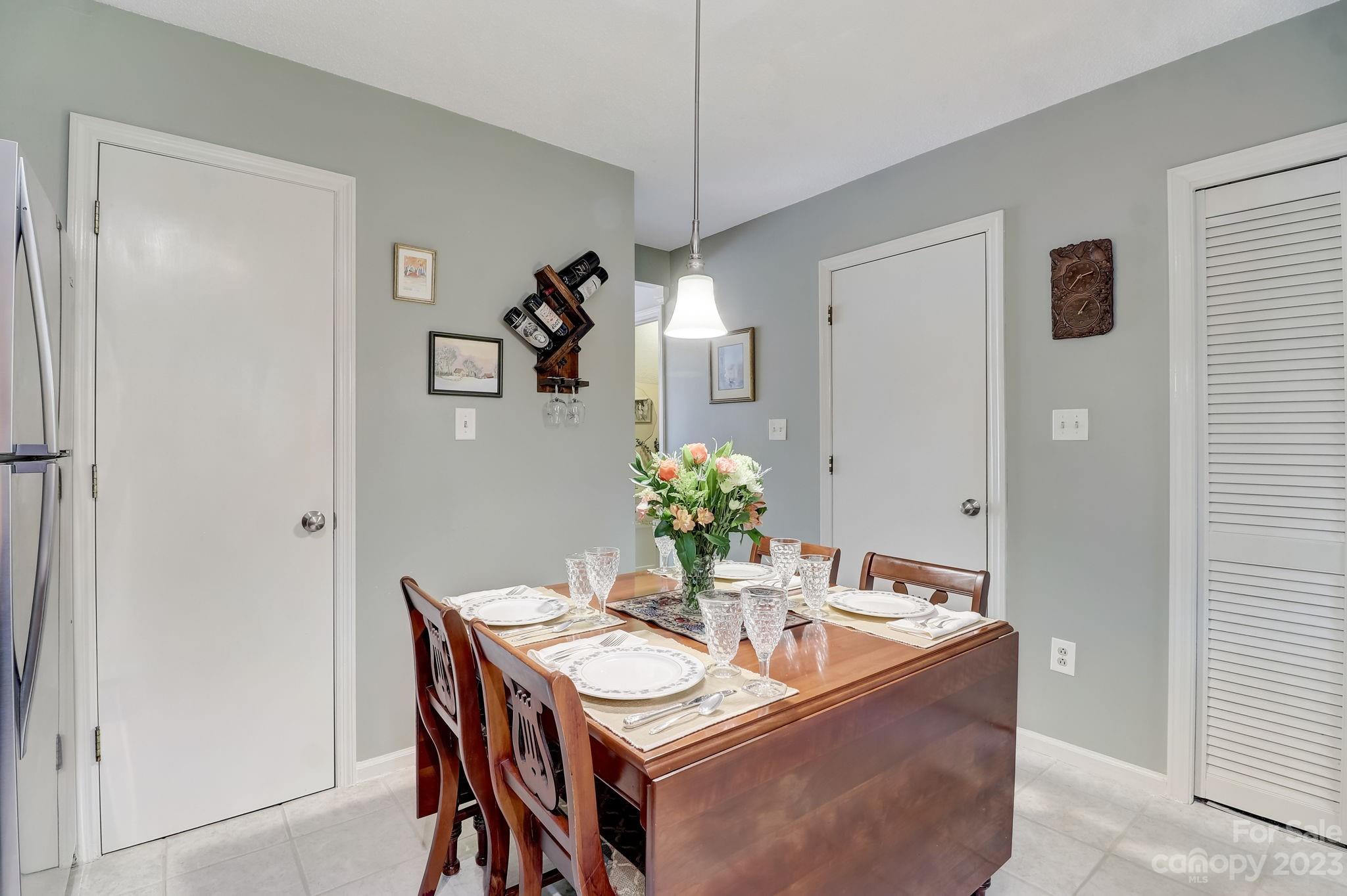 4 Bramblewood Road, Unit 8 Arden, NC 28704 - Photo 8 of 25 a dining room with furniture and wooden floor