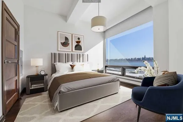 a bed room with furniture and a chandelier