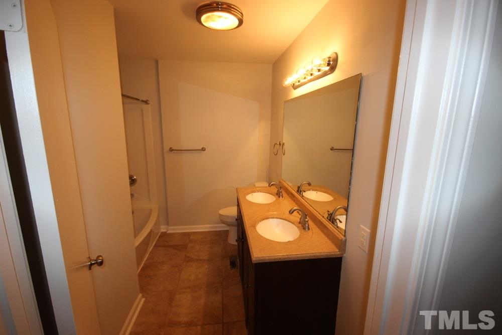 1725 Euclid Road Durham, NC 27713 - Photo 14 of 23 a bathroom with a granite countertop sink and mirror