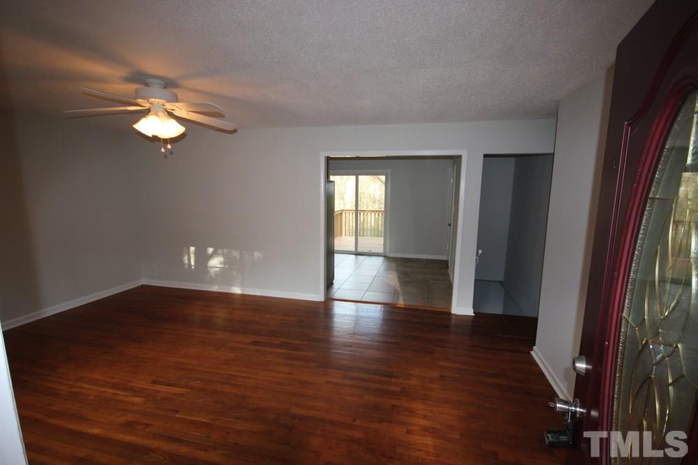 1725 Euclid Road Durham, NC 27713 - Photo 3 of 23 wooden floor in an empty room with a window
