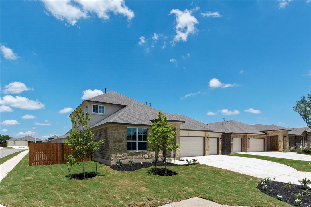 4217 Porter Farm Road Georgetown, TX 78628 - Photo 1 of 17 a front view of a house with a yard