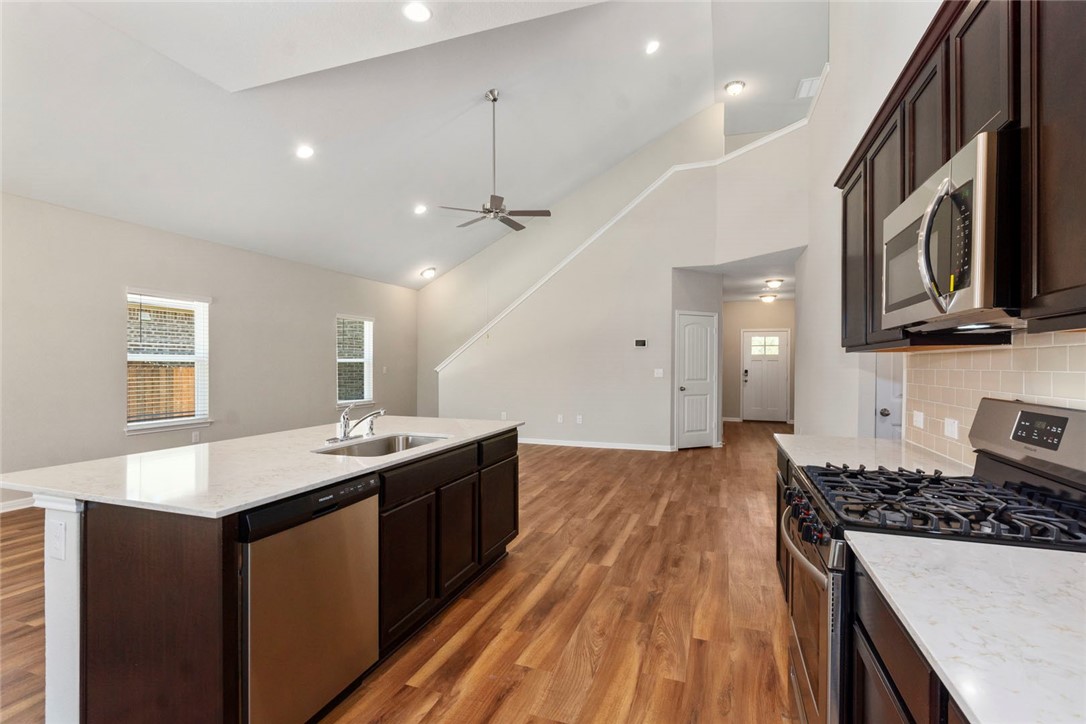 4217 Porter Farm Road Georgetown, TX 78628 - Photo 8 of 17 a kitchen with sink stove and refrigerator