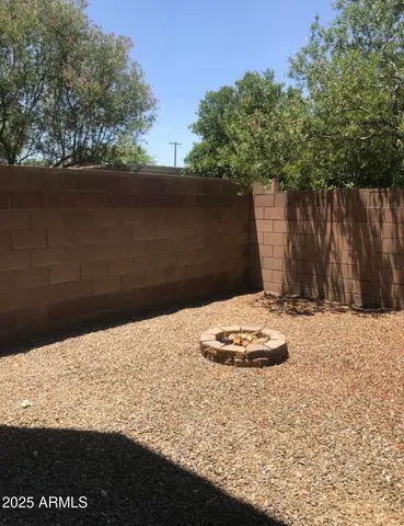 a wooden floor with a trees in the background