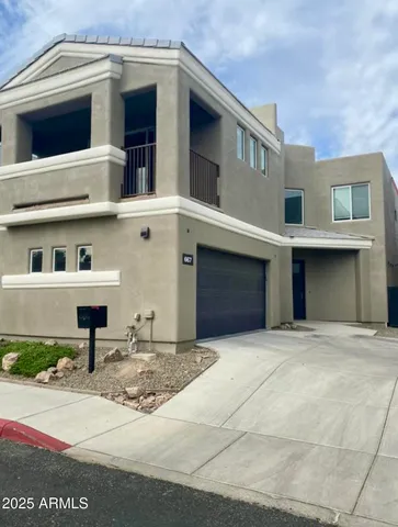 a front view of a house with yard