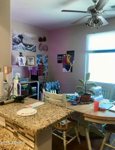 a room with a table and chairs