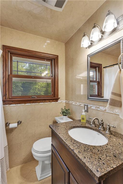 360 Orr Avenue Apollo, PA 15613 - Photo 16 of 24 a bathroom with a granite countertop sink a toilet and a mirror
