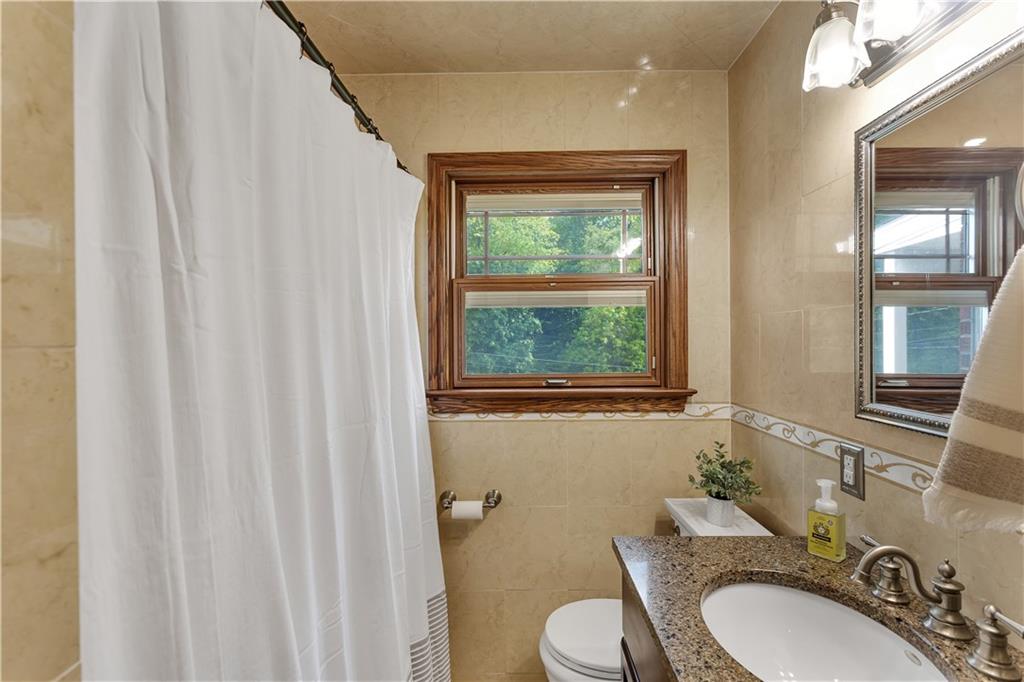 360 Orr Avenue Apollo, PA 15613 - Photo 17 of 24 a bathroom with a granite countertop sink vanity mirror and toilet