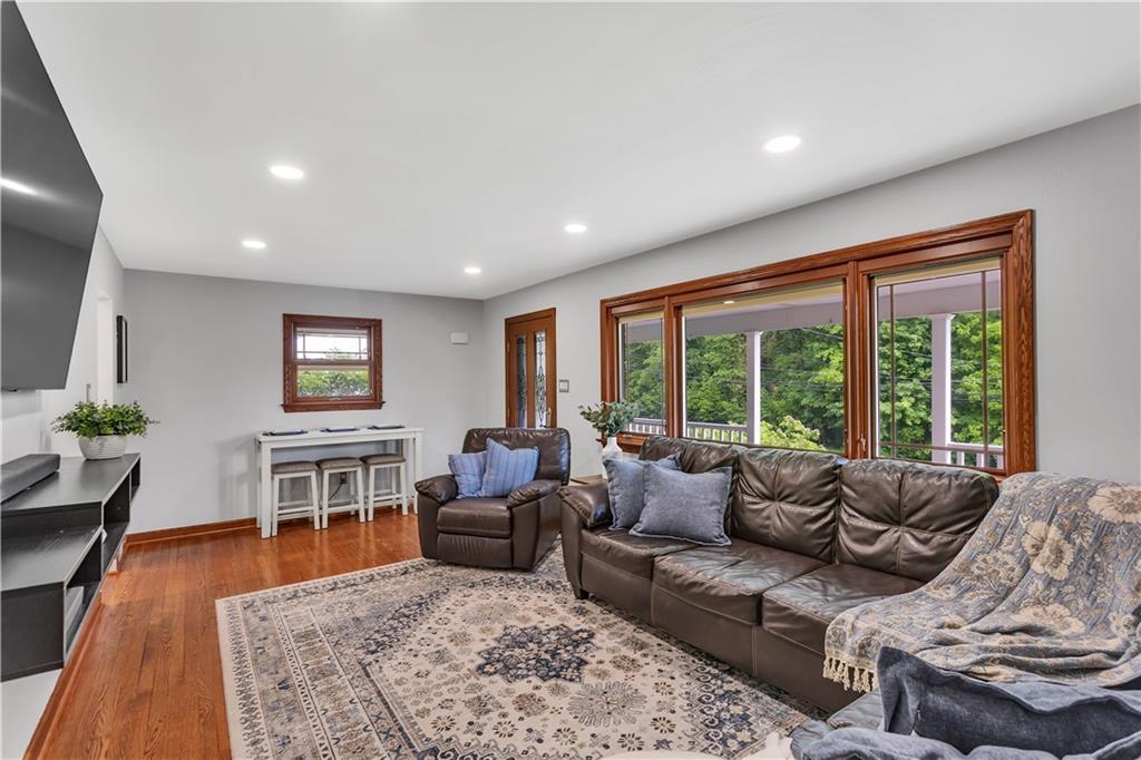 360 Orr Avenue Apollo, PA 15613 - Photo 6 of 24 a living room with furniture a flat screen tv and a rug