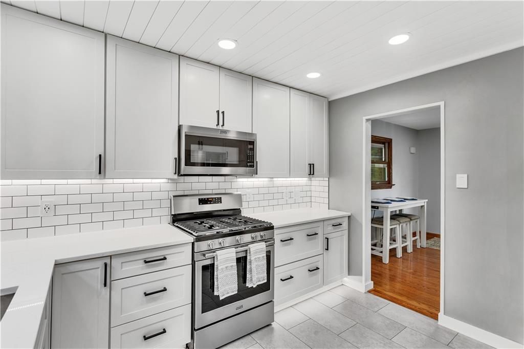 360 Orr Avenue Apollo, PA 15613 - Photo 9 of 24 a kitchen with stainless steel appliances white cabinets and a stove top oven