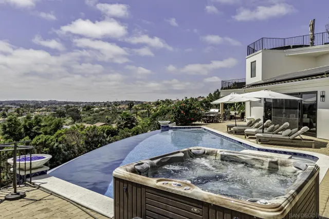 a living room with fireplace furniture and a chandelier