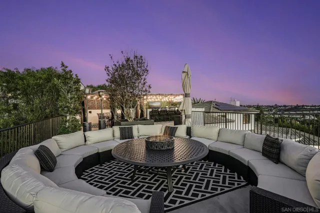 a kitchen with stainless steel appliances kitchen island granite countertop a stove and white cabinets
