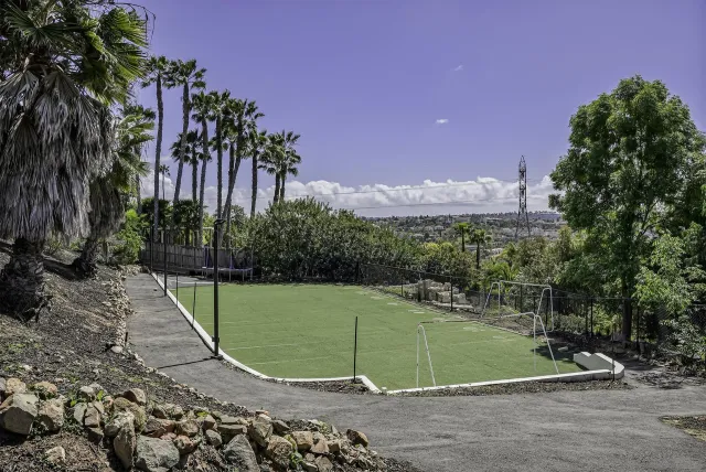 a living room with furniture a dining table and view kitchen view with wooden floor