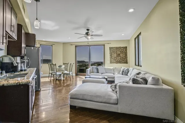 a bedroom with a large bed and a large window