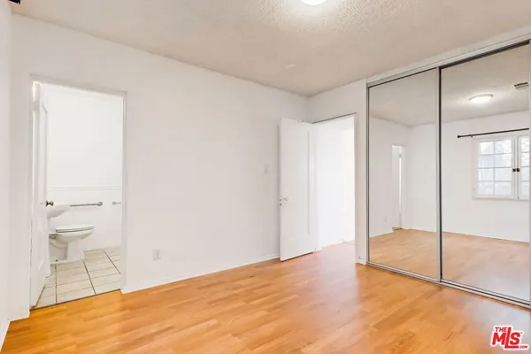 a bathroom with a shower and a sink