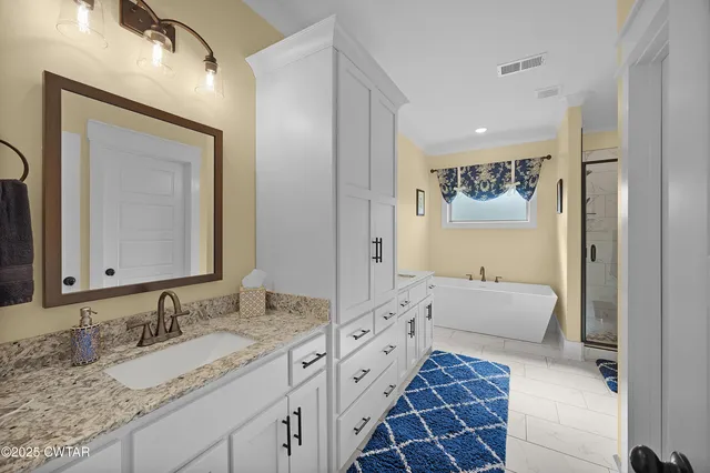a bathroom with a granite countertop sink mirror and a