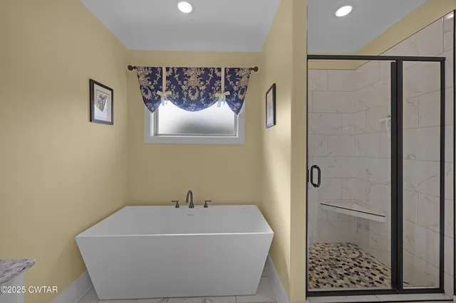 a white bath tub sitting in a bathroom