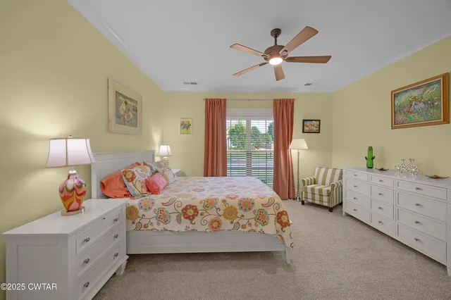 a bedroom with bed and window