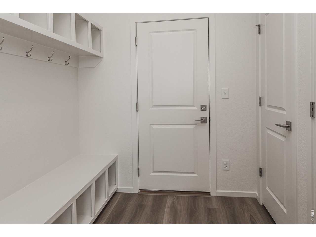 6079 Red Barn Road Timnath, CO 80547 - Photo 21 of 44 Owner's entry with built in shelves and hooks