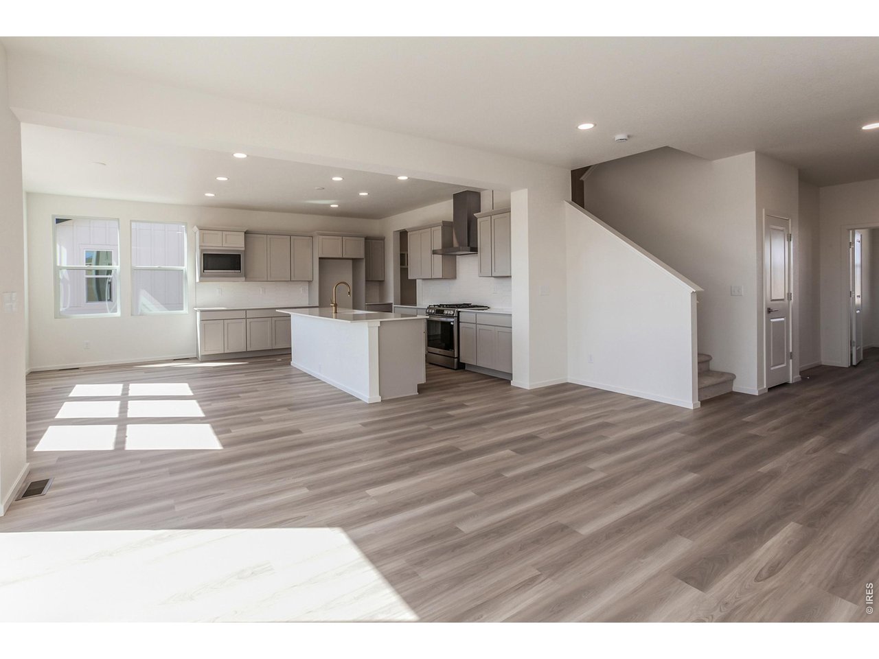 6079 Red Barn Road Timnath, CO 80547 - Photo 6 of 44 Vinyl plank flooring throughout main level
