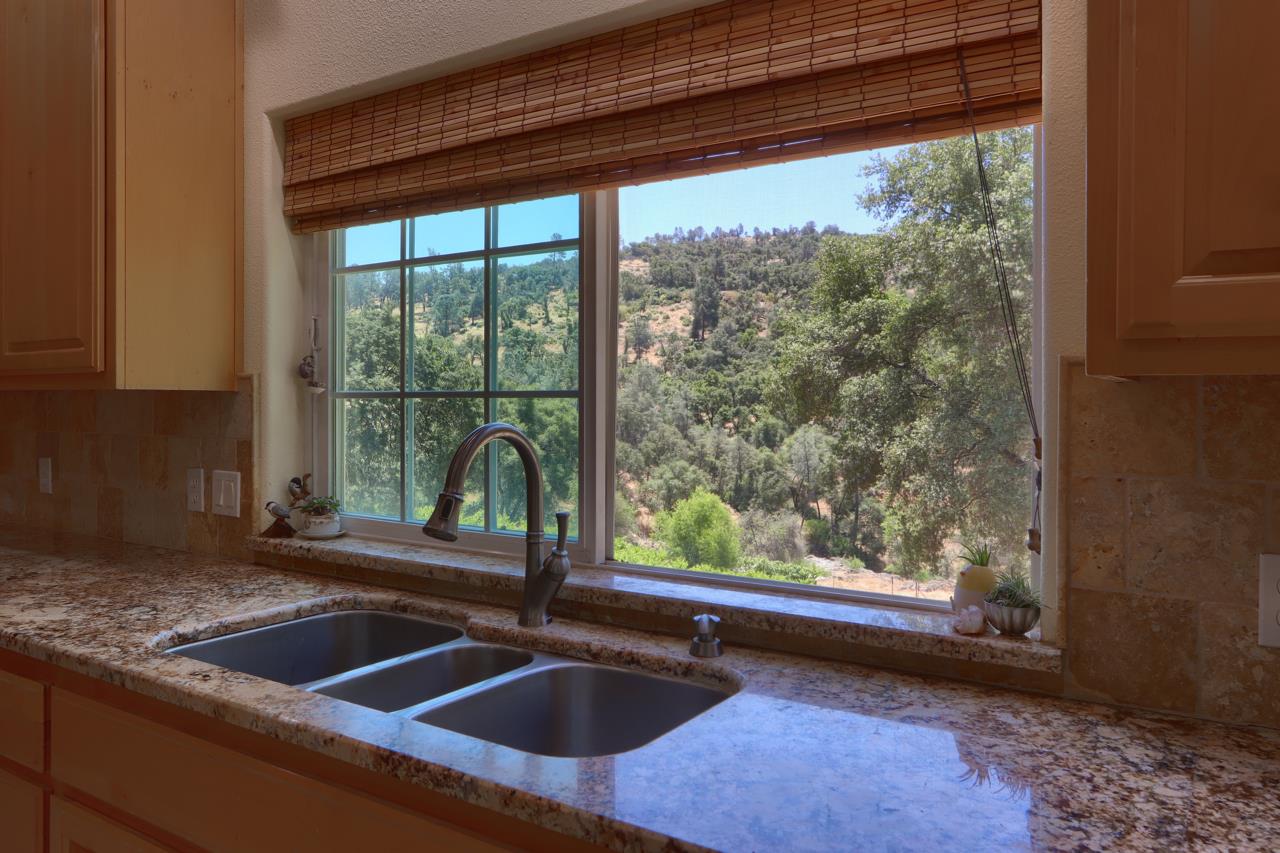 7551 Hunters Valley Road Mariposa, CA 95338 - Photo 27 of 78 a kitchen sink sitting next to a window