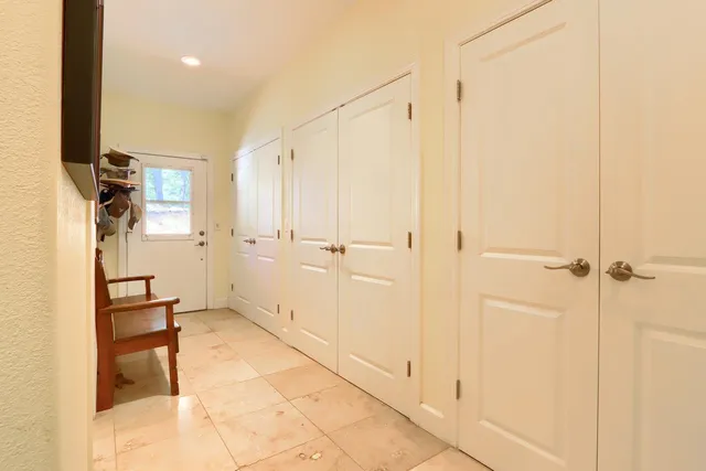 a view of a book shelf with lots of racks on the wall