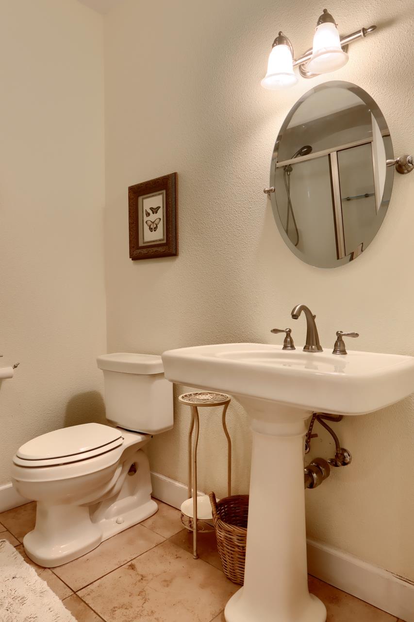 7551 Hunters Valley Road Mariposa, CA 95338 - Photo 31 of 78 a bathroom with a toilet sink and mirror