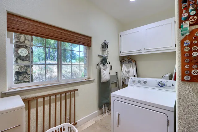 a bed room with a bed and a chandelier