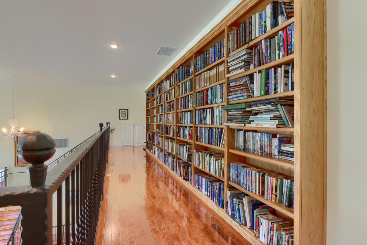 7551 Hunters Valley Road Mariposa, CA 95338 - Photo 39 of 78 a view of a book shelf with lots of racks on the wall