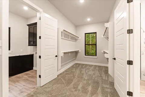 a view of an entryway with wooden floor