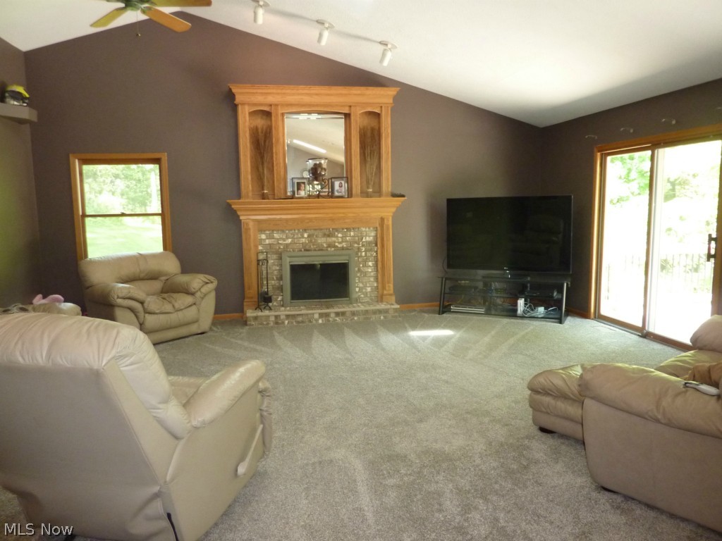 11060 Fairmount Road Newbury, OH 44065 - Photo 12 of 25 Vaulted Great Room, Custom Fireplace Mantel, Sliders to Multi-Tiered Decking!