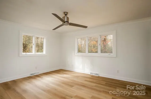 a view of empty room with windows