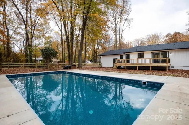 a view of a swimming pool with a patio