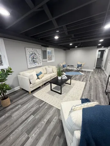 a living room with furniture and a table