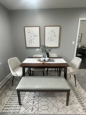 a view of a dining room with furniture