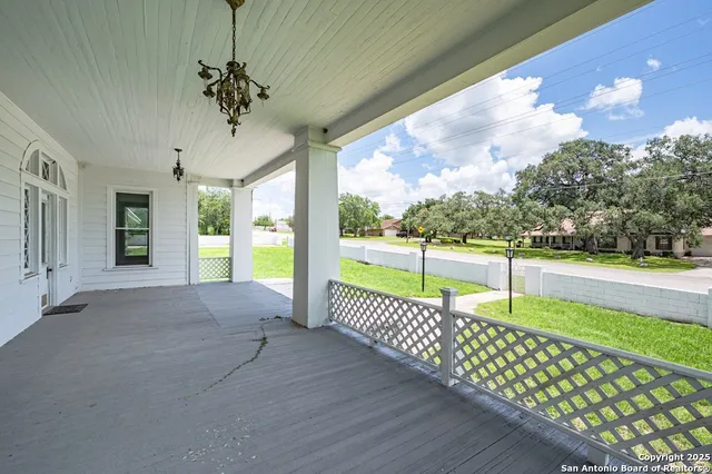 a view of a porch and garden